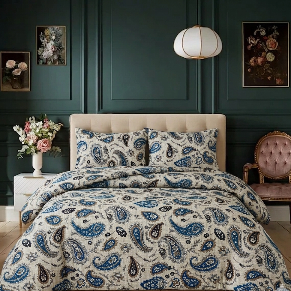 Bedroom with paisley-patterned bedding, floral arrangement, and dark green walls.