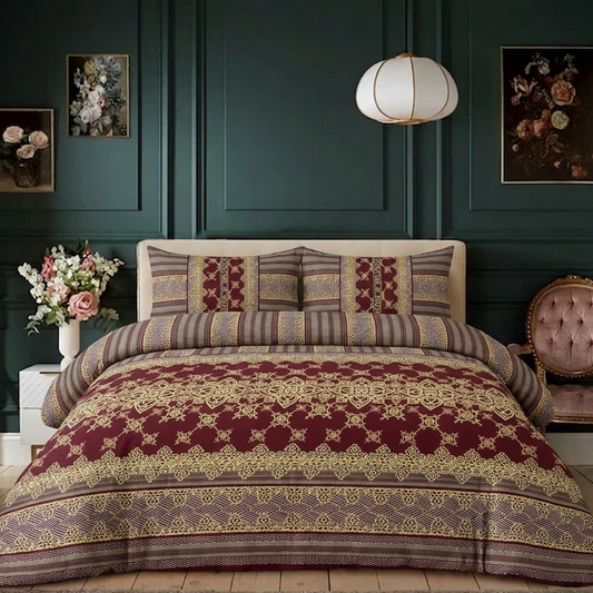 Decorative bedspread with intricate patterns in a bedroom setting.