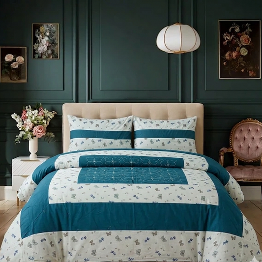 Bedroom with floral bedding and decorative elements on a dark green wall.
