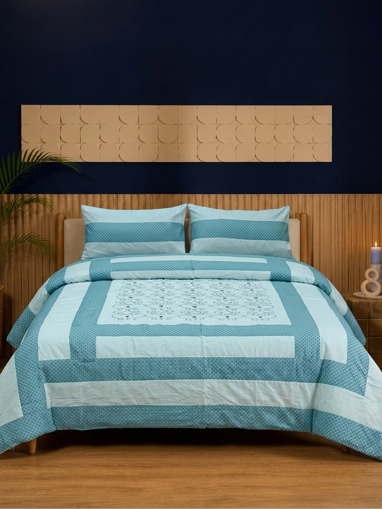 Blue and white striped quilt on a bed with wooden headboard and nightstands.