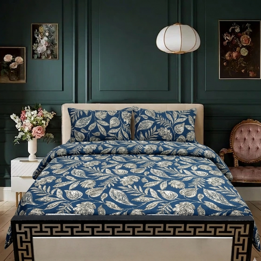Bedroom with floral bedspread and decorative elements on a dark green wall.